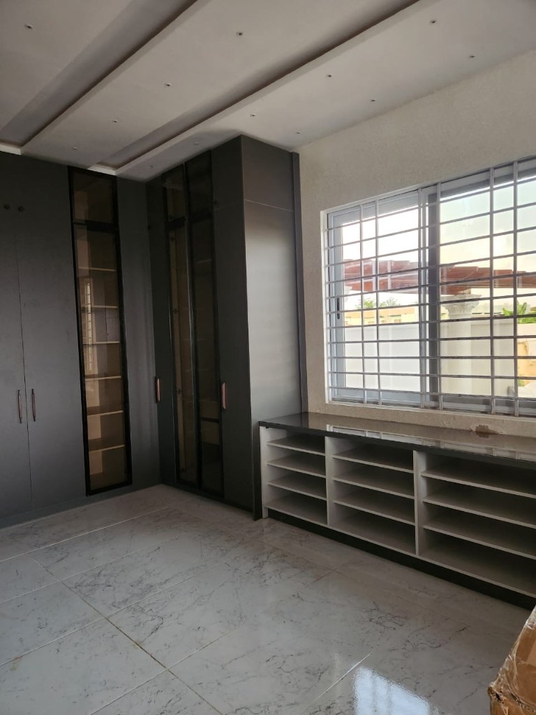 Charcoal L-shaped built-in wardrobes with glass display