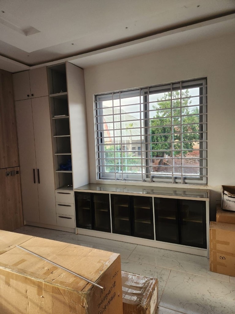 Custom wardrobe and under-window storage unit