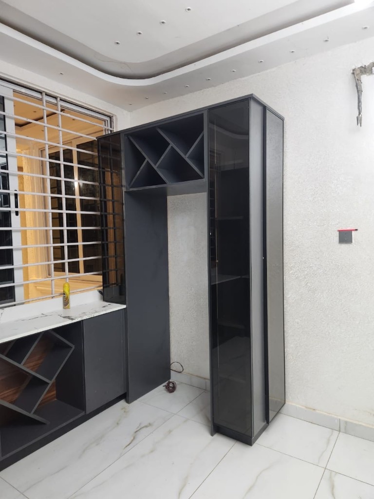 Charcoal cabinetry with integrated wine racks