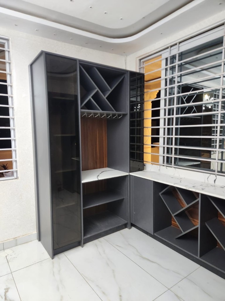 Charcoal and marble L-shaped home bar